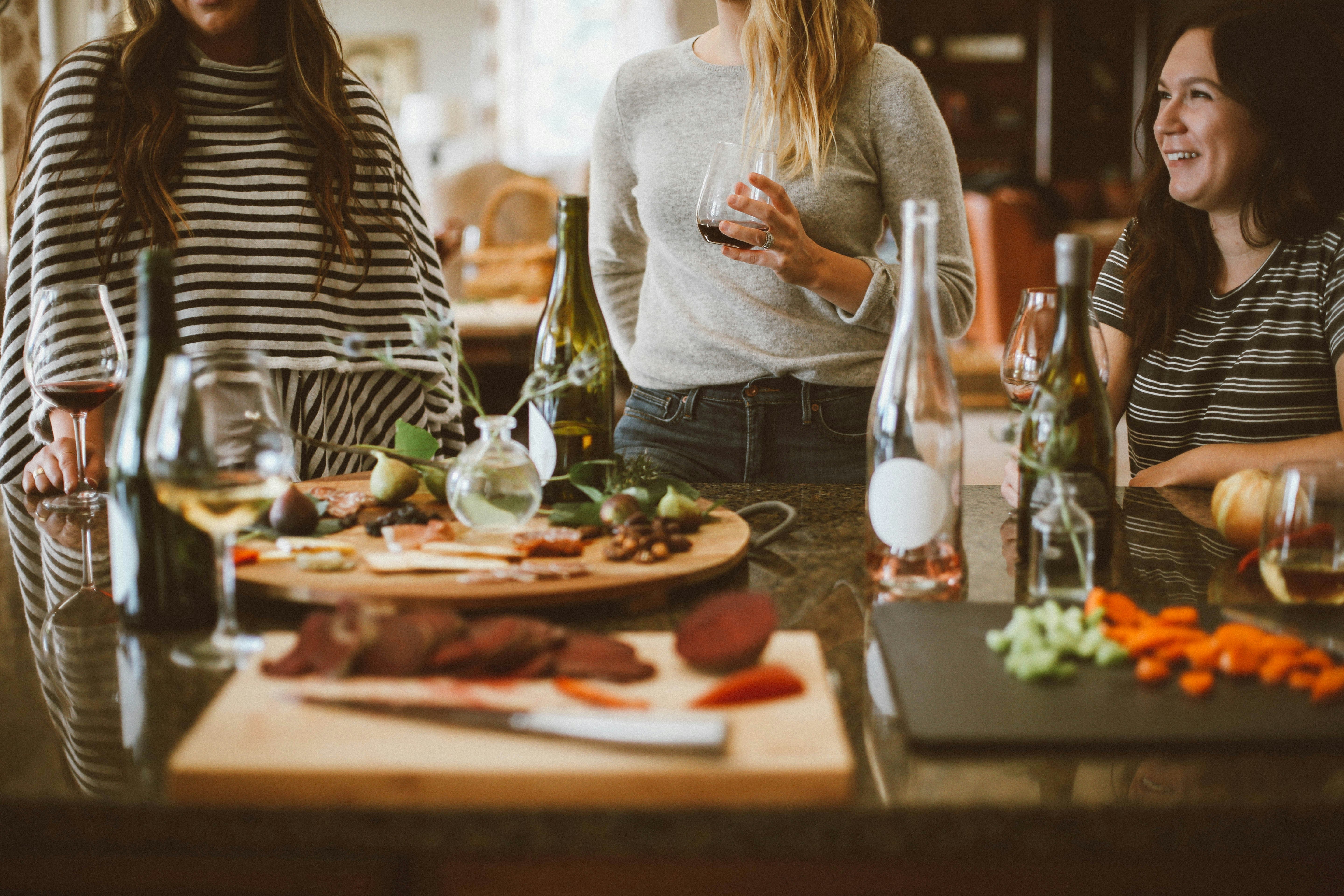 Friends entertaining with wine